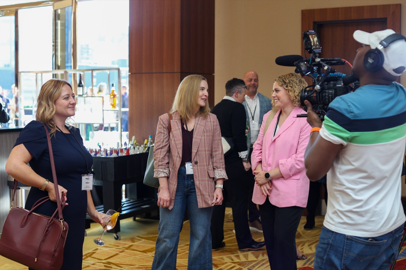 AmeriFilms founder Souley Oumarou filming guests at a business event